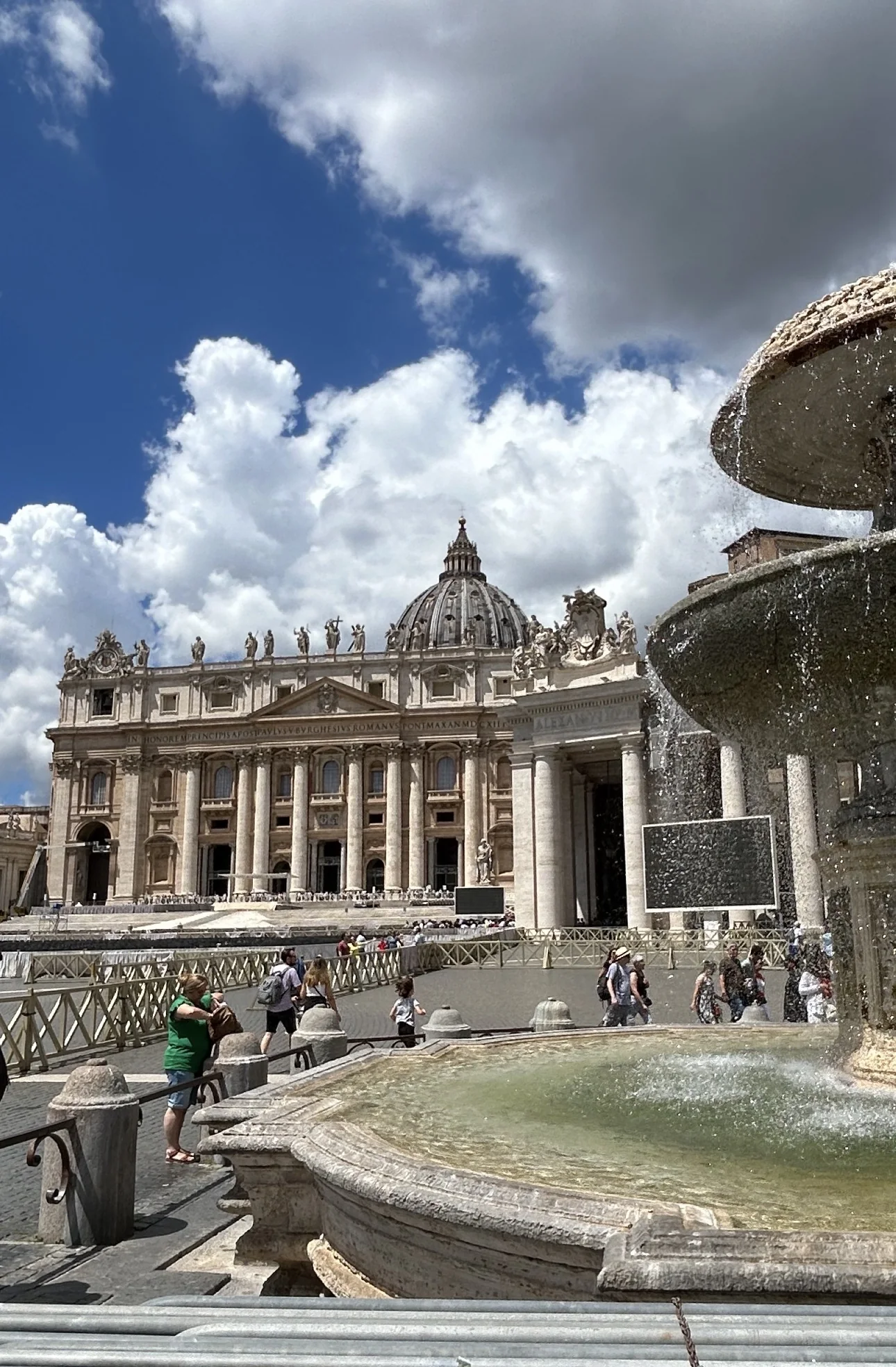 The facade and dome of St. Peter's Basilica from St. Peter's Square, with Maderno's fountain in the foreground